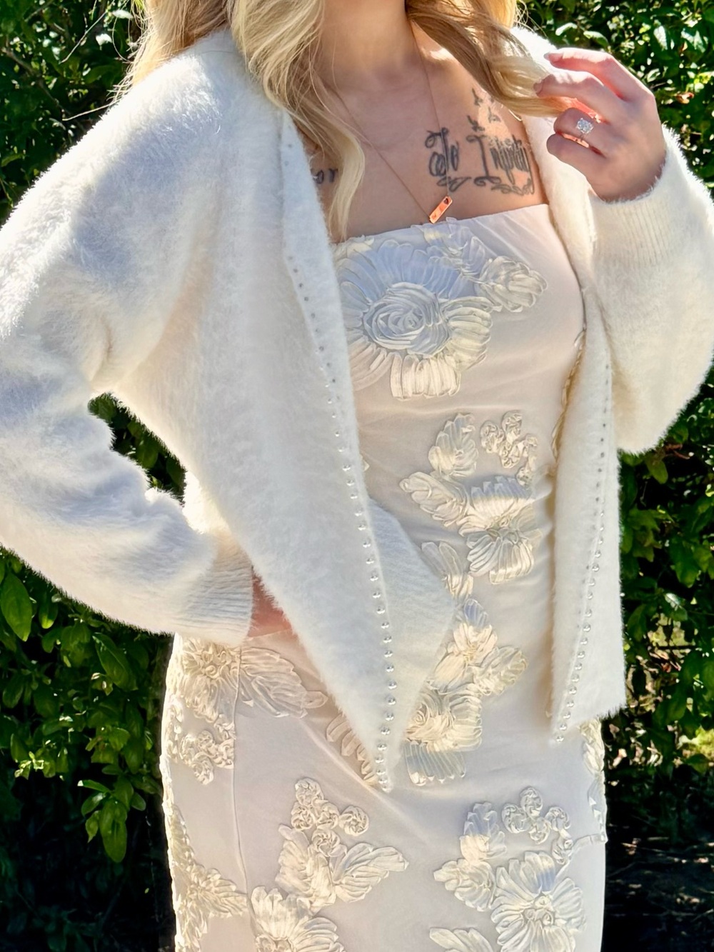 White fuzzy cardigan with pearl accents